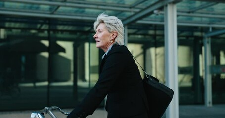 Businesswoman, commute and riding a bike to work, health and wellness. Mature person, urban and journey or transport to office, active and cardio in eco friendly, bicycle and carbon neutral footprint