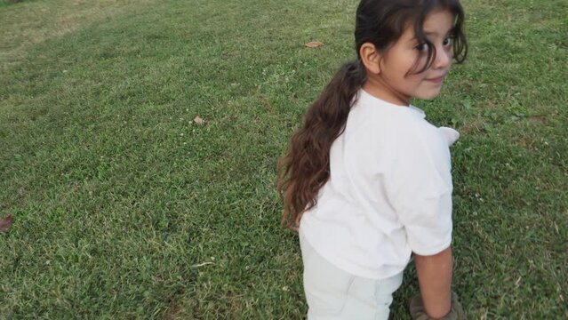 Pre-Adolescent Girl Doing The Splits On A Lawn.MOV