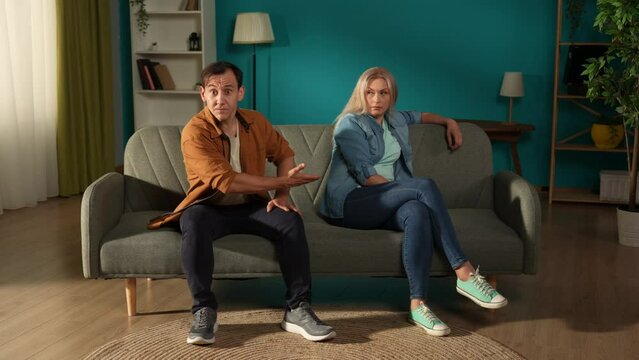 A visit to a family psychologist for a married couple. A man talks indignantly about problems in his relationship while sitting next to a woman who ignores him. Crisis of relationships in family life.