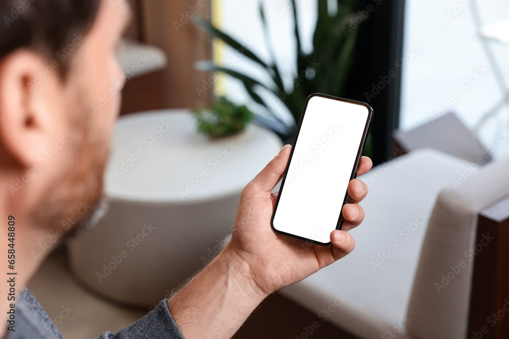Poster man using smartphone in cafe, closeup view