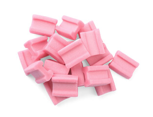 Pile of tasty pink chewing gums on white background, top view