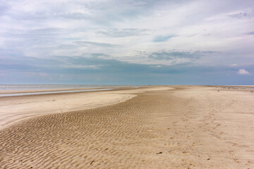 Fototapeta na wymiar Saint Peter Ording beach impression in summer on a cloudy day, North Frisia, Schleswig-Holstein, germany