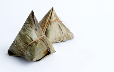 Zongzi, steamed rice dumplings with chili sauce. Close up, copy space, famous asian tasty food in dragon boat duanwu festival