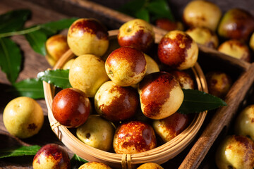 Fresh ripe Jujube Fruits with on wooden table.