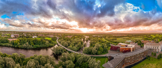 Aerial panoramic view of Living Bridge, curving modern pedestrian crossing over the Shannon river...