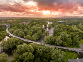 Aerial panoramic view of Living Bridge, curving modern pedestrian crossing over the Shannon river...