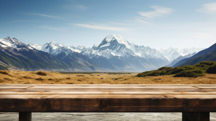 Empty wooden table top with blur background of mountain landscape