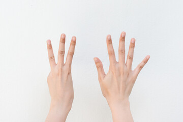 Women showing finger on white background.Counting number eight.