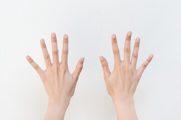 Women showing finger on white background.Counting number ten.