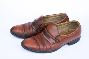 Men's brown leather shoes isolated on white background .