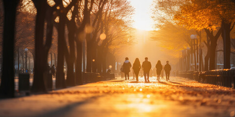 Blurred street people in Korea perspective people walking in late afternoon with long shadow walkway in the park defocused image use for background - obrazy, fototapety, plakaty