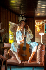 woman with guitar at the bar