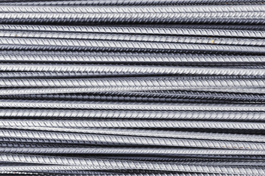 Metal, iron background, set of reinforced steel. Steel armature. Gray new metal fittings. The bars of reinforcement.
