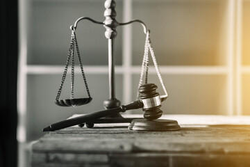 Wooden legal gavel on wooden table, judge hammer for final verdict It represents the rights and...