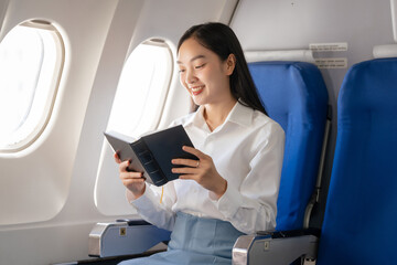 Reading a book, Thoughtful asian people female person onboard, airplane window, perfectly capture the anticipation and excitement of holiday travel. chinese, japanese people.