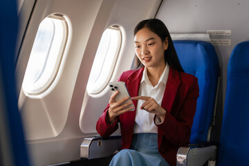 Passionate female asian chinese japanese people student aboard airplane, clutching textbooks,...