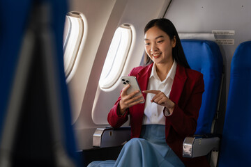 Passionate female asian chinese japanese people student aboard airplane, clutching textbooks,...
