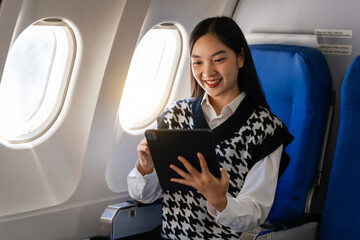 Passionate female asian chinese japanese people student aboard airplane, clutching textbooks,...