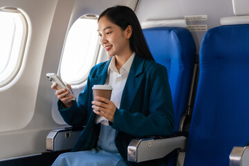 Young asian chinese japanese people female adventurer in-flight, mapping out destinations as she...