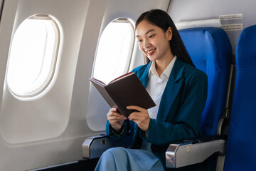 Young asian chinese japanese people female adventurer in-flight, mapping out destinations as she voyages worldwide. woman passenger of airplane. travel around the world.