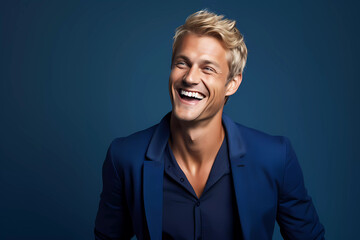 Fototapeta premium Dashing Blond Man with Blue Eyes in Navy Outfit Against a Solid Navy Backdrop