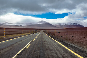 Road in Atacama desert savanna, mountains and volcano landscape, Chile, South America
