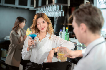 woman and bartender atalking in roof top bar