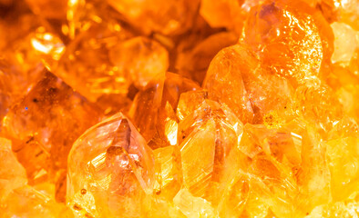 Golden crystal mineral stone. Gems. Mineral crystals in the natural environment. Texture of precious and semiprecious stones. Seamless background with copy space.