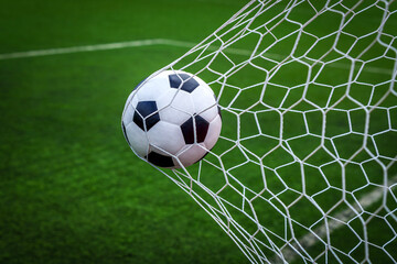 soccer ball on goal with net background