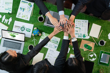 Business synergy in panoramic top view banner of business people holding hand together as team...