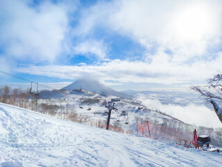 Seeing snowy volcano from ski slope (Niseko, Hokkaido, Japan)