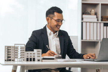 Agent presents contracts for property purchase or lease. Businessman asian indian people showcases...