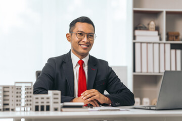 Agent presents contracts for property purchase or lease. Businessman asian indian people showcases...