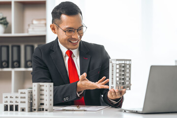 Agent presents contracts for property purchase or lease. Businessman asian indian people showcases...