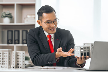 Agent presents contracts for property purchase or lease. Businessman asian indian people showcases...