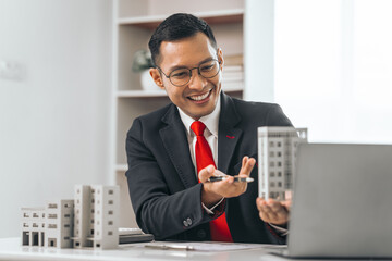 Agent presents contracts for property purchase or lease. Businessman asian indian people showcases...