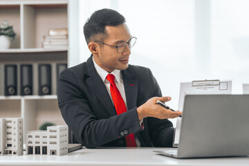 Agent presents contracts for property purchase or lease. Businessman asian indian people showcases...