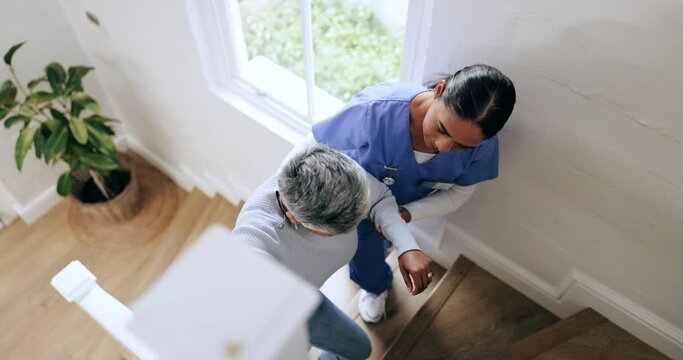 Senior, woman and nurse with help on stairs for disability, wellness and care in retirement home or house. Elderly, professional and caregiver with support on steps for healthcare, safety or homecare