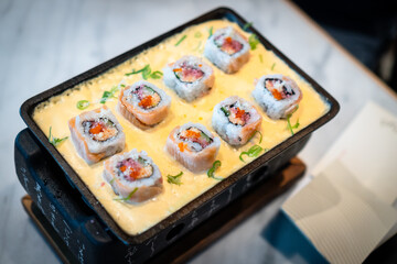 Japanese sushi with cheese sauce