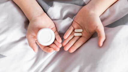 Pills vitamins and supplement for better immunity. Child taking medicines pills and bottle .Medical concept.