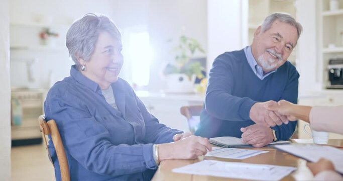 Home, senior couple and documents with handshake, retirement and meeting with pension fund, financial advisor and agreement. Worker, elderly man and old woman with paperwork and insurance in a lounge