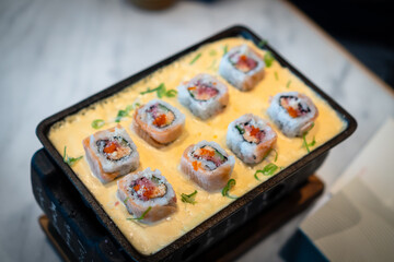Japanese sushi with cheese sauce