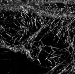 Wrinkled plastic wrap texture on a black background wallpaper. Royalty high-quality free stock photo image of realistic plastic wrap for overlay, copy space and photo effect. Wrinkled plastic surface