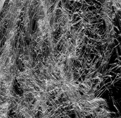 Wrinkled plastic wrap texture on a black background wallpaper. Royalty high-quality free stock photo image of realistic plastic wrap for overlay, copy space and photo effect. Wrinkled plastic surface