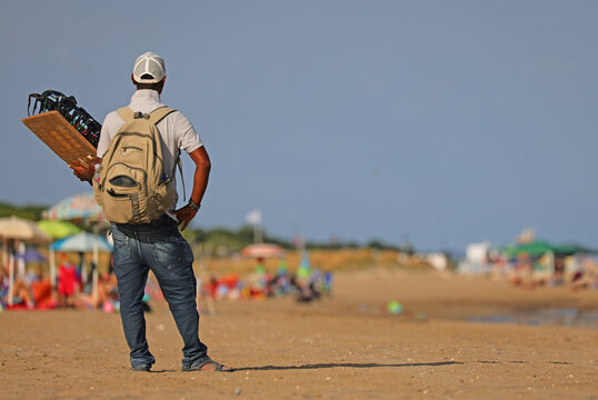 illegal hawker in the beach by the sea in summer