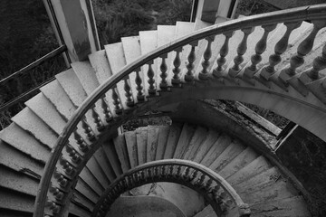 spiral round stairs stairway railing empire style window concrete. round Staircase. Time vortex. abandoned soviet sanatorium. Tskaltubo Georgia. - obrazy, fototapety, plakaty