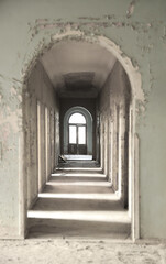 Horror hallway with little lighting background. Long empty dark corridor in abandoned building, perspective. Abandoned school, sanatorium  corridor perspective. many opened doors. destroyed in ruins