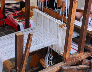Ancient spinning frame to  weave cotton and wool threads