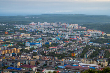 Obraz premium Morning cityscape. Top view of the buildings and streets of the city. Residential urban areas at dawn. Beautiful aerial city landscape. Petropavlovsk-Kamchatsky, Kamchatka Krai, Far East of Russia.