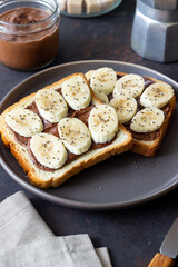 Sandwich with chocolate paste, banana and chia seeds. Breakfast. Vegetarian food.
